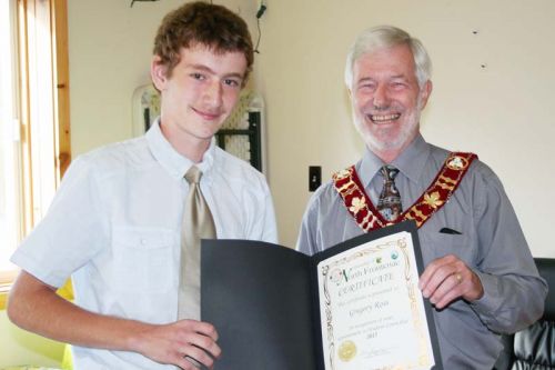 North Frontenac Student Coun. Gregory Ross’s term is up and he was presented with a certificate from Mayor Ron Higgins. The 13-year-old will be going into Grade 9 at GREC and said he plans to pursue a political career, federal, provincial or municipal in the future, probably within the Conservative Party. Photo/Craig Bakay